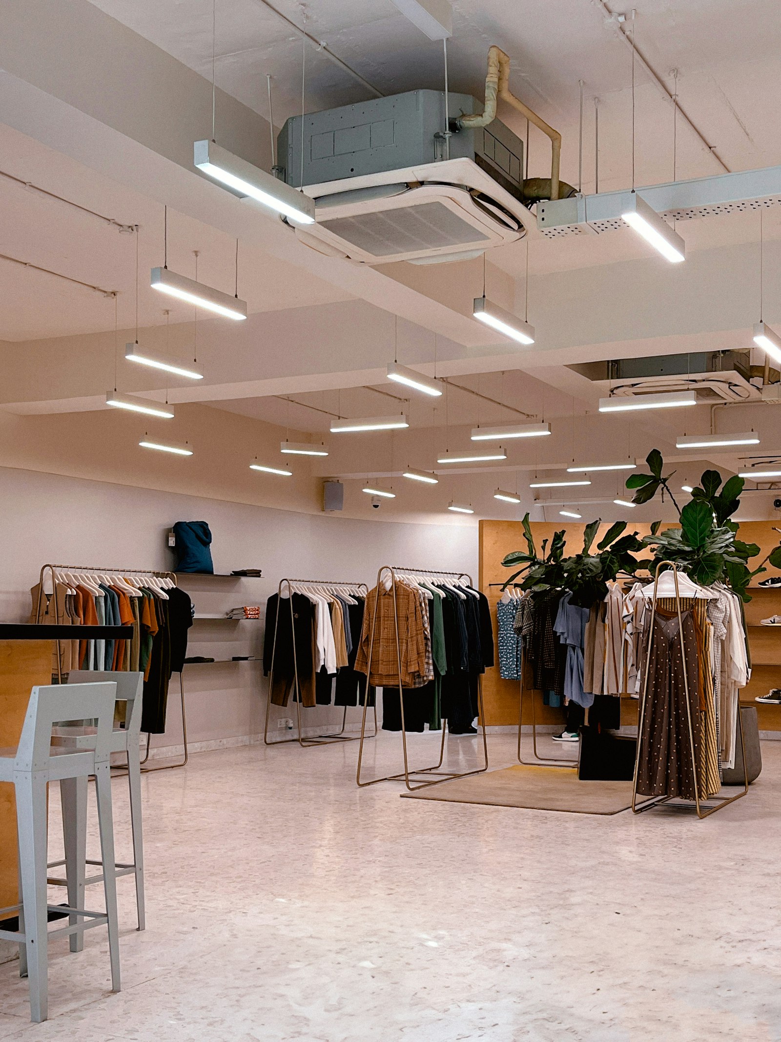 A modern clothing store with racks of apparel